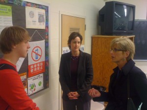 Governor Whitman speaking with Dr. Goodman and one of her students