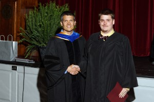 Dr. Ed Lowry, Assistant Professor of Biology, presents Drake Bishop '14 with the Hewett Award