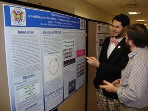 Stephen Woodall '15 explaining his research on prostate cancer to Dr. Nick Deifel from the H-SC Chemistry Department