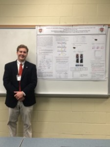 Travis Goodloe '16 and his poster describing a method he developed for detecting melanoma cells within lymph nodes