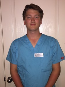 The author in his scrubs and ready to work