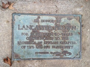 A marker recognizing Lancaster Brown's work lays just in front of the Chi Phi steps.
