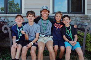 Coleman Meadows at camp with young children