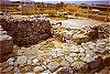 Possibly a bathroom, sloping floor and drain hole, Tiryns